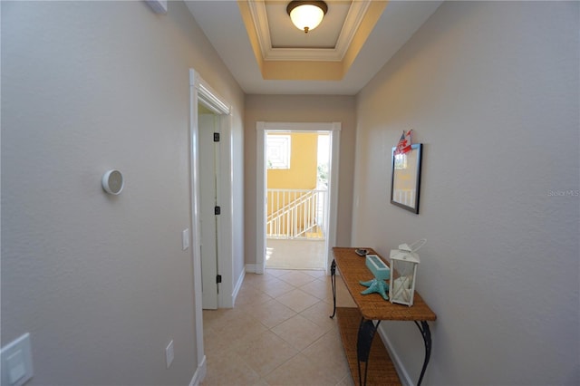 hallway with a raised ceiling