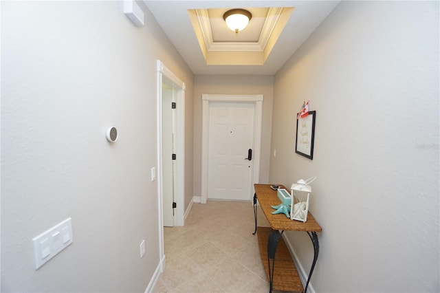 hallway with a raised ceiling