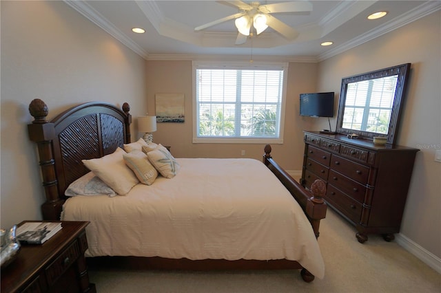 bedroom with light colored carpet, a raised ceiling, ceiling fan, and ornamental molding