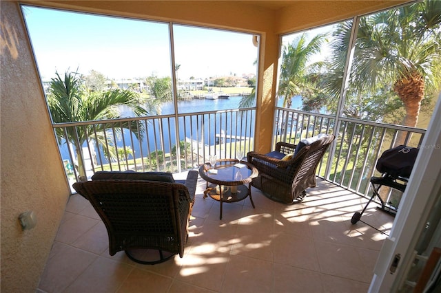 sunroom / solarium with a water view