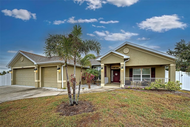 ranch-style home featuring a front yard, a porch, and a garage