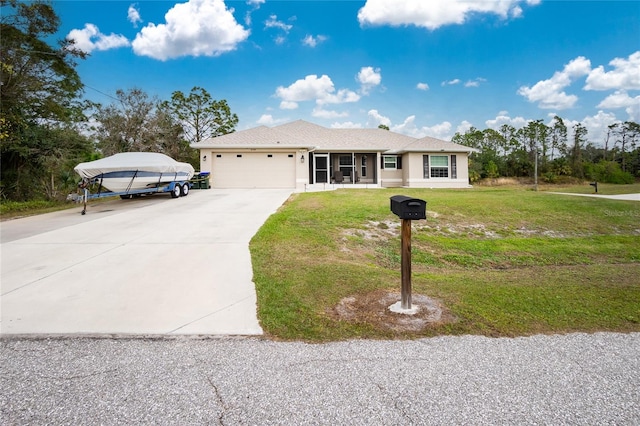 view of front of home featuring a front yard and a garage