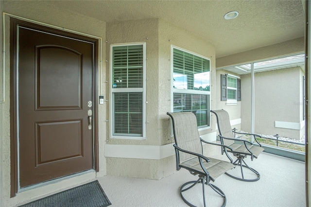 doorway to property with covered porch