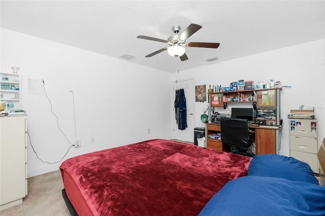 carpeted bedroom featuring washer / clothes dryer and ceiling fan