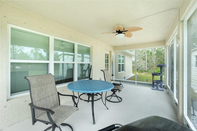 sunroom / solarium with ceiling fan