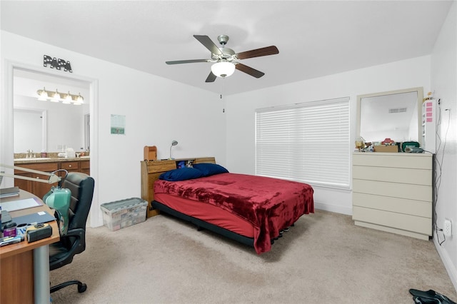 bedroom featuring sink, ceiling fan, and carpet flooring