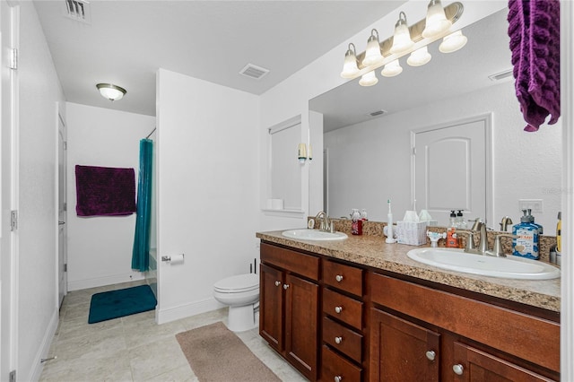 bathroom featuring toilet, vanity, tile patterned flooring, and a shower with curtain