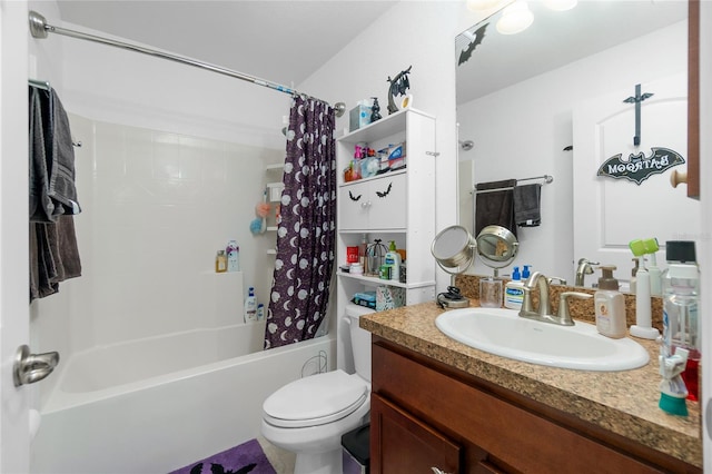 full bathroom featuring shower / bath combo with shower curtain, vanity, and toilet