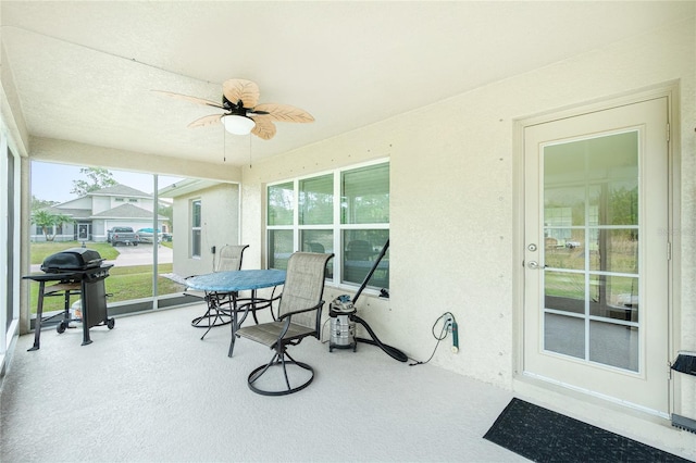 sunroom / solarium with ceiling fan