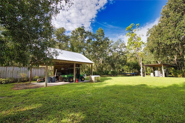 view of yard with a trampoline