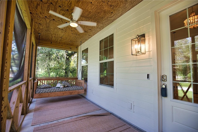 exterior space featuring ceiling fan and a porch