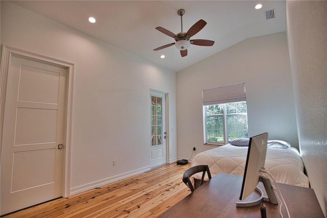 bedroom with light wood-type flooring, vaulted ceiling, and ceiling fan