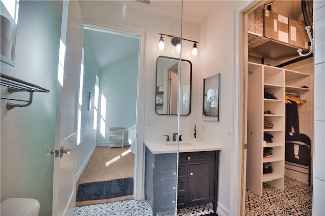 bathroom with tile patterned floors and vanity