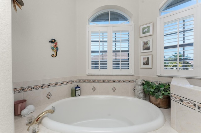 bathroom featuring tiled bath