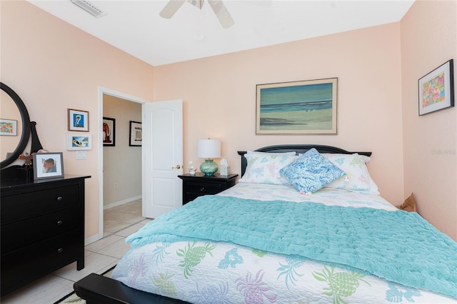 tiled bedroom with ceiling fan