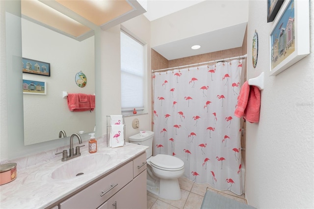 bathroom featuring tile patterned flooring, vanity, toilet, and walk in shower