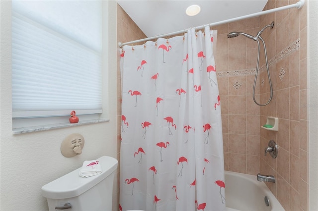 bathroom with shower / bathtub combination with curtain and toilet