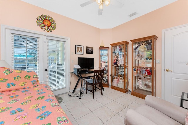 bedroom with ceiling fan, access to exterior, and light tile patterned floors