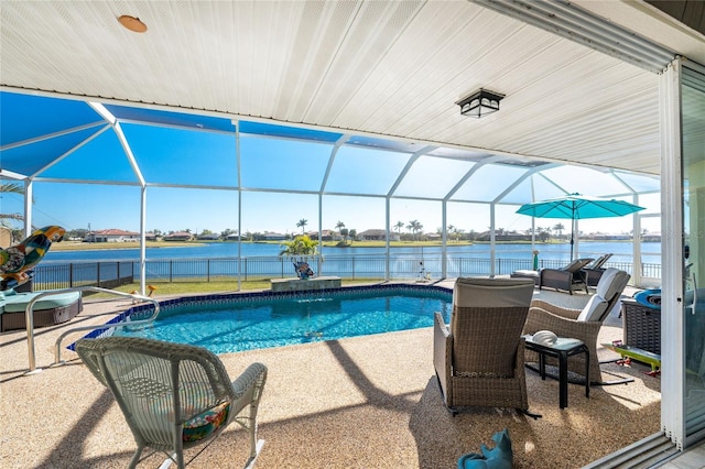 view of pool with a water view, glass enclosure, and a patio area