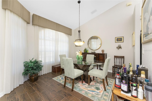 24337 Contra Costa Ln, Punta Gorda, FL 33955 - dining area with lofted ceiling and dark wood-style floors