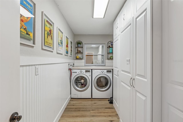 washroom with light wood-type flooring and washer and clothes dryer