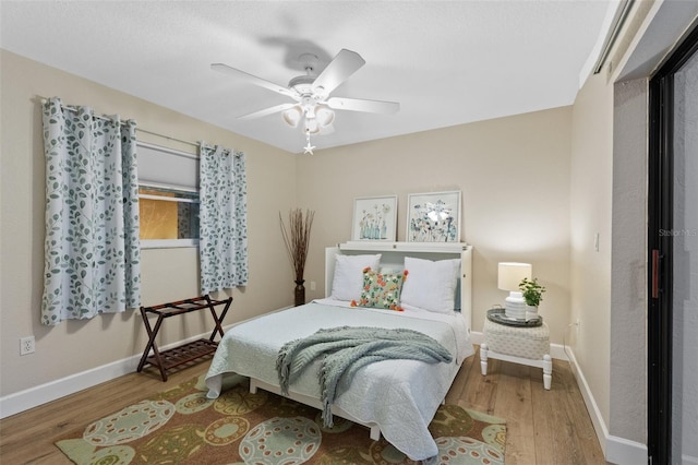 bedroom featuring hardwood / wood-style floors and ceiling fan