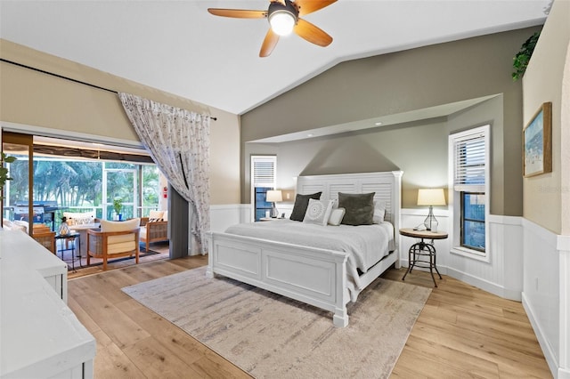 bedroom featuring lofted ceiling, access to outside, ceiling fan, and light wood-type flooring