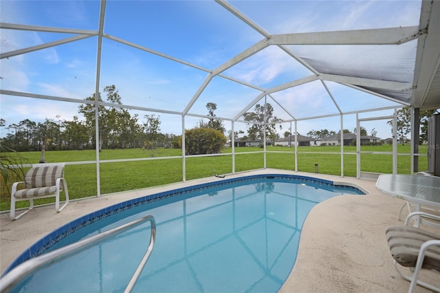 view of swimming pool featuring a patio, a lawn, and a lanai