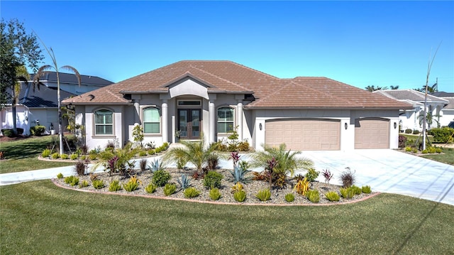 view of front facade with a front lawn and a garage