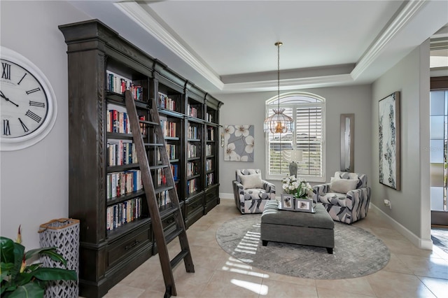 living area featuring a raised ceiling, a chandelier, and light tile patterned floors