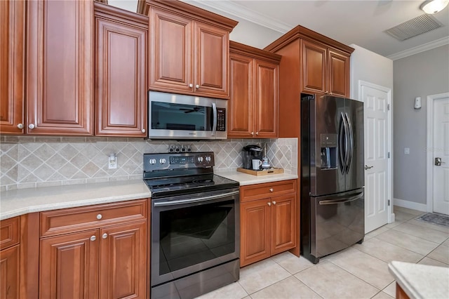 kitchen with stainless steel appliances, crown molding, tasteful backsplash, and light tile patterned floors