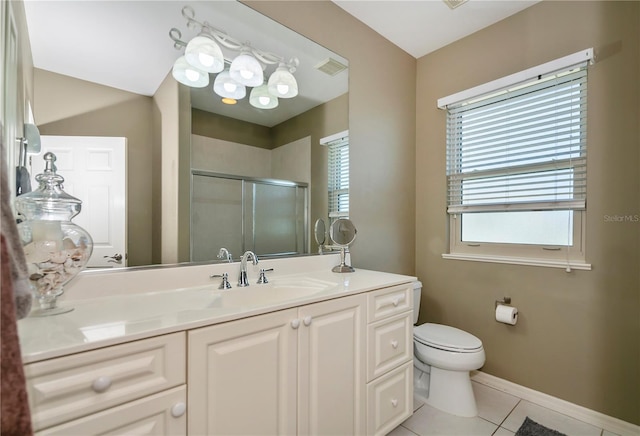 bathroom featuring toilet, an enclosed shower, tile patterned flooring, and vanity