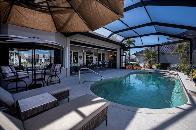 view of pool with a lanai and a patio area