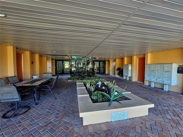 view of patio with a mail area