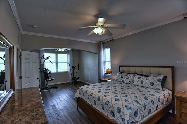 bedroom with baseboards, multiple windows, wood finished floors, and ornamental molding