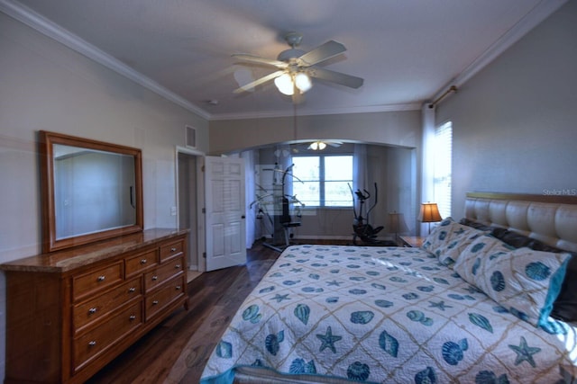 bedroom with arched walkways, visible vents, ornamental molding, and dark wood-style flooring