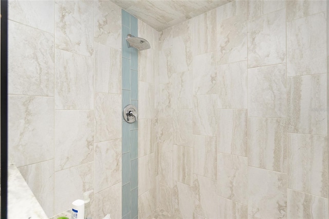 bathroom with tiled shower