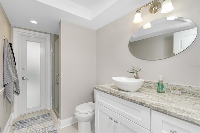 bathroom featuring vanity, toilet, an enclosed shower, and tile patterned flooring