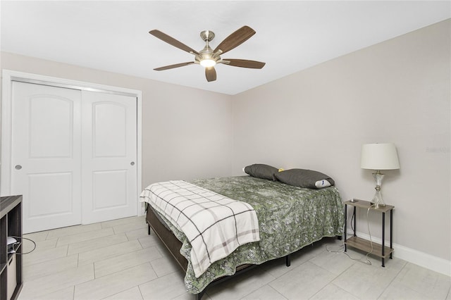 bedroom with ceiling fan and a closet