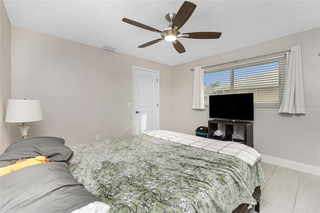 bedroom with light tile patterned flooring and ceiling fan