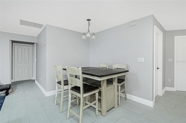 dining area with a chandelier