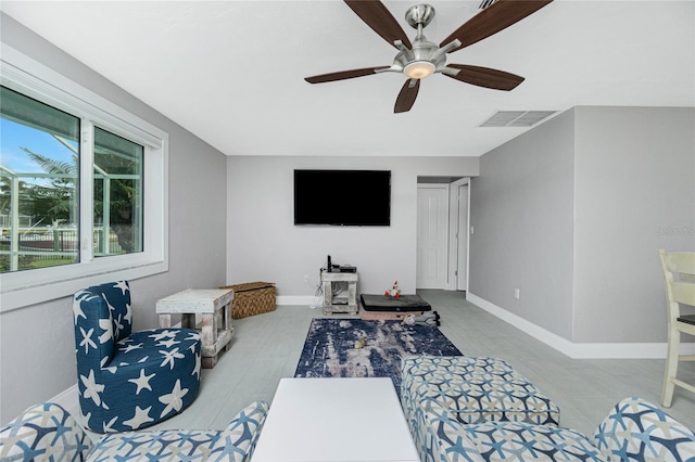 sitting room featuring ceiling fan and light wood-type flooring