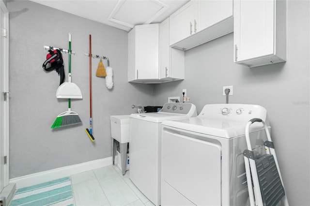 laundry area featuring cabinets and separate washer and dryer