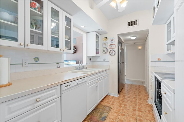 kitchen featuring white cabinetry, dishwasher, sink, decorative backsplash, and light tile patterned flooring