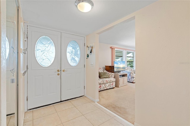 view of carpeted entrance foyer