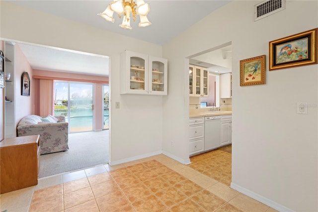 interior space featuring sink and a notable chandelier