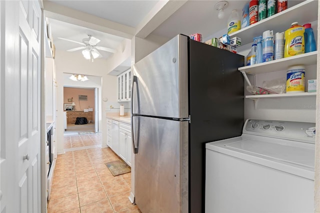 laundry room featuring washer / dryer, light tile patterned floors, and ceiling fan