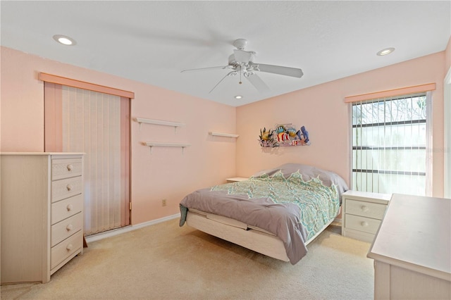 carpeted bedroom featuring ceiling fan