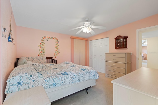 bedroom featuring light carpet, a closet, and ceiling fan