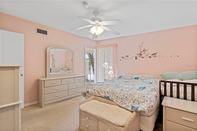 bedroom featuring light colored carpet and ceiling fan